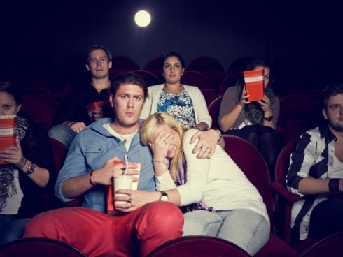 scared-girl-with-her-boyfriend-in-cinema